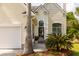 Inviting front entrance with decorative wreath, fresh flowers and lush landscaping at 2632 Planters Pointe Blvd, Mount Pleasant, SC 29466