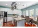 Bright kitchen with modern appliances, granite countertops, and a breakfast nook at 2632 Planters Pointe Blvd, Mount Pleasant, SC 29466