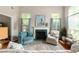Cozy living room with fireplace, comfortable seating, and bright windows at 2632 Planters Pointe Blvd, Mount Pleasant, SC 29466