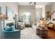 Comfortable living room with large windows, fireplace, and neutral decor at 2632 Planters Pointe Blvd, Mount Pleasant, SC 29466