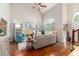 Spacious living area featuring hardwood floors, high ceilings, and a ceiling fan at 2632 Planters Pointe Blvd, Mount Pleasant, SC 29466