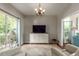 Bright living room with large windows, elegant furniture, and modern lighting at 2632 Planters Pointe Blvd, Mount Pleasant, SC 29466