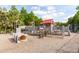 Explore the community playground, complete with slides, climbing structures, and wood chip ground cover at 2632 Planters Pointe Blvd, Mount Pleasant, SC 29466