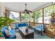 Inviting screened porch offering comfortable seating, a coffee table, and a ceiling fan at 2632 Planters Pointe Blvd, Mount Pleasant, SC 29466