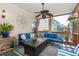 Comfortable screened porch with stylish seating and decor, perfect for outdoor relaxation and entertaining at 2632 Planters Pointe Blvd, Mount Pleasant, SC 29466