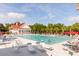 Enjoy the community pool with ample seating, umbrellas, and a clubhouse, perfect for relaxing on sunny days at 2632 Planters Pointe Blvd, Mount Pleasant, SC 29466
