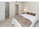 Bedroom boasts en suite bathroom with shower, neutral carpet and large bed at 2901 Dove Haven Ct # C, Charleston, SC 29414