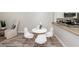 Dining room area featuring modern white furniture and natural light at 2901 Dove Haven Ct # C, Charleston, SC 29414