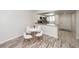 Open-concept dining area with seating for four adjacent to an open kitchen at 2901 Dove Haven Ct # C, Charleston, SC 29414