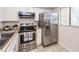 A functional kitchen featuring stainless steel appliances, white cabinets, and bright natural light at 2901 Dove Haven Ct # C, Charleston, SC 29414