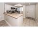 Open concept kitchen featuring stainless appliances, tiled floors, and a breakfast bar at 2901 Dove Haven Ct # C, Charleston, SC 29414