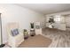 Open living room and dining area with neutral tones and light wood floors at 2901 Dove Haven Ct # C, Charleston, SC 29414