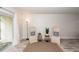 Living room with area rug and matching cushioned chairs at 2901 Dove Haven Ct # C, Charleston, SC 29414