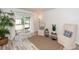 Living room with neutral tones, area rug, decor, and sliding door to a screened-in patio at 2901 Dove Haven Ct # C, Charleston, SC 29414