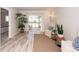 Bright living room with neutral tones, wood flooring and a sliding door to a screened patio at 2901 Dove Haven Ct # C, Charleston, SC 29414