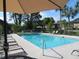 Refreshing pool area with shaded seating, providing a relaxing oasis with lounge chairs at 2901 Dove Haven Ct # C, Charleston, SC 29414