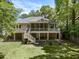 Backyard featuring a spacious deck with outdoor seating and lush lawn at 3021 Rushland Mews, Johns Island, SC 29455