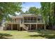 Backyard featuring a spacious deck with outdoor seating and lush lawn at 3021 Rushland Mews, Johns Island, SC 29455