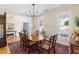 Elegant dining room with hardwood floors and ample natural light, perfect for Gathering gatherings and entertaining at 3021 Rushland Mews, Johns Island, SC 29455