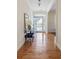 Welcoming foyer with hardwood floors and a stylish console table, creating an inviting entrance to the home at 3021 Rushland Mews, Johns Island, SC 29455
