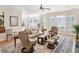 Spacious living room features hardwood floors, neutral colors, and a seamless flow to the dining area at 3021 Rushland Mews, Johns Island, SC 29455