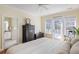 Bright main bedroom with hardwood floors and an ensuite bathroom at 3021 Rushland Mews, Johns Island, SC 29455
