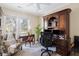 Office space features a built-in wooden desk and cabinet and natural light at 3021 Rushland Mews, Johns Island, SC 29455