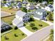Aerial view of a residential area featuring homes with well-manicured lawns at 303 Seneca River Dr, Summerville, SC 29485