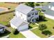 Aerial view of a home with a large yard and detached garage at 303 Seneca River Dr, Summerville, SC 29485