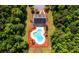Aerial view showcasing the community pool and clubhouse surrounded by lush greenery and parking at 303 Seneca River Dr, Summerville, SC 29485