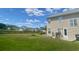 Spacious backyard featuring a wooden deck, fire pit, and a fenced yard at 303 Seneca River Dr, Summerville, SC 29485