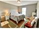 Well-lit bedroom with hardwood floors, a queen size bed, and neutral colored walls at 303 Seneca River Dr, Summerville, SC 29485