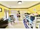 Bright bedroom featuring a bunk bed, a rocking chair, and yellow walls at 303 Seneca River Dr, Summerville, SC 29485