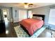 Bedroom featuring dark wood floors and bedframe, a decorative rug and an access to a doorway at 303 Seneca River Dr, Summerville, SC 29485