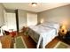 Neutral colored bedroom with a queen sized bed and hardwood floors at 303 Seneca River Dr, Summerville, SC 29485