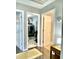 Hallway showing access to three rooms: the laundry room, a closet, and another storage area at 303 Seneca River Dr, Summerville, SC 29485
