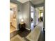 Hallway shows the bathroom, a bedroom with a red chair and a room with colorful walls at 303 Seneca River Dr, Summerville, SC 29485