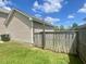 Practical side yard featuring a wooden fence and convenient access, ideal for storage or gardening at 303 Seneca River Dr, Summerville, SC 29485