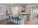 Stylish kitchen with stainless appliances, ample counter space, and seating at the island at 303 Willow Run Dr, Summerville, SC 29486
