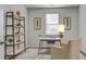 Bright office space with a modern desk, comfortable chair, and stylish shelving for storage and decor at 303 Willow Run Dr, Summerville, SC 29486