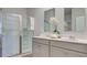 Modern bathroom showcasing a glass-enclosed shower, double vanity, and sleek design at 311 Willow Run Dr, Summerville, SC 29486