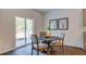The breakfast nook offers a view of the backyard through sliding glass doors for natural light at 311 Willow Run Dr, Summerville, SC 29486