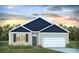 Charming single-Gathering home showcasing a well-manicured lawn, stylish siding, and an attached garage at 311 Willow Run Dr, Summerville, SC 29486