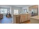 Bright kitchen featuring an island, stainless steel appliances, and an open floor plan to the living room at 311 Willow Run Dr, Summerville, SC 29486