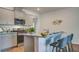 A well-equipped kitchen featuring granite countertops, stainless steel appliances, and bar stool seating at 311 Willow Run Dr, Summerville, SC 29486