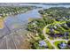 Expansive aerial view showcasing stunning waterfront homes with private docks and piers at 314 Commonwealth Rd, Mount Pleasant, SC 29466