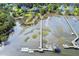 Breathtaking aerial view of a private dock with boats, highlighting the serene waterfront lifestyle at 314 Commonwealth Rd, Mount Pleasant, SC 29466