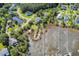 An aerial view showing the neighborhood, pond, waterway, private boat docks and beautiful homes at 314 Commonwealth Rd, Mount Pleasant, SC 29466