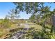 Enjoy the view from the backyard, with a fire pit and relaxing adirondack chairs at 314 Commonwealth Rd, Mount Pleasant, SC 29466