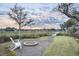 Waterfront lot features a relaxing fire pit area and wooden walkway to the neighborhood dock at 314 Commonwealth Rd, Mount Pleasant, SC 29466